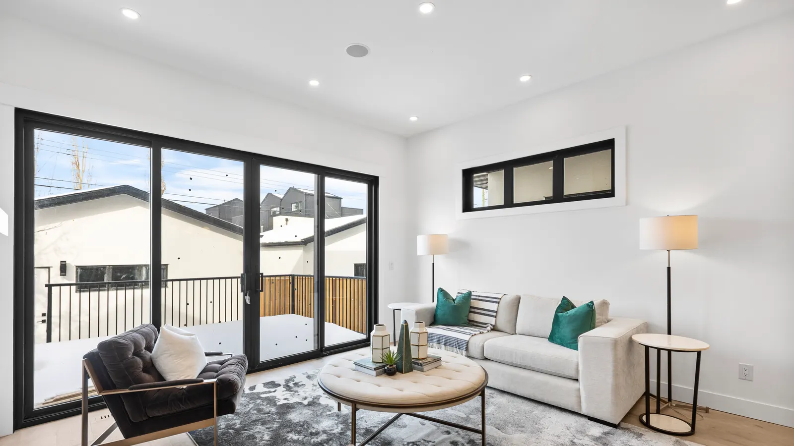 Clean, light-filled luxury living room in a Calgary home prepared for a real estate photo shoot