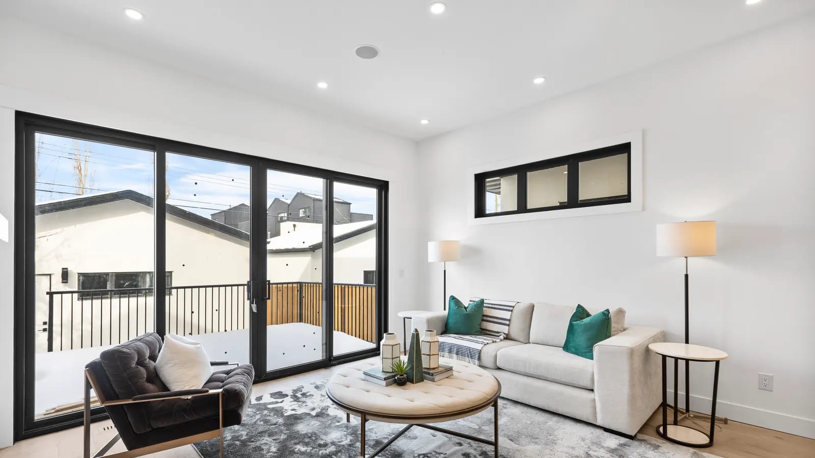 Clean, light-filled luxury living room in a Calgary home prepared for a real estate photo shoot